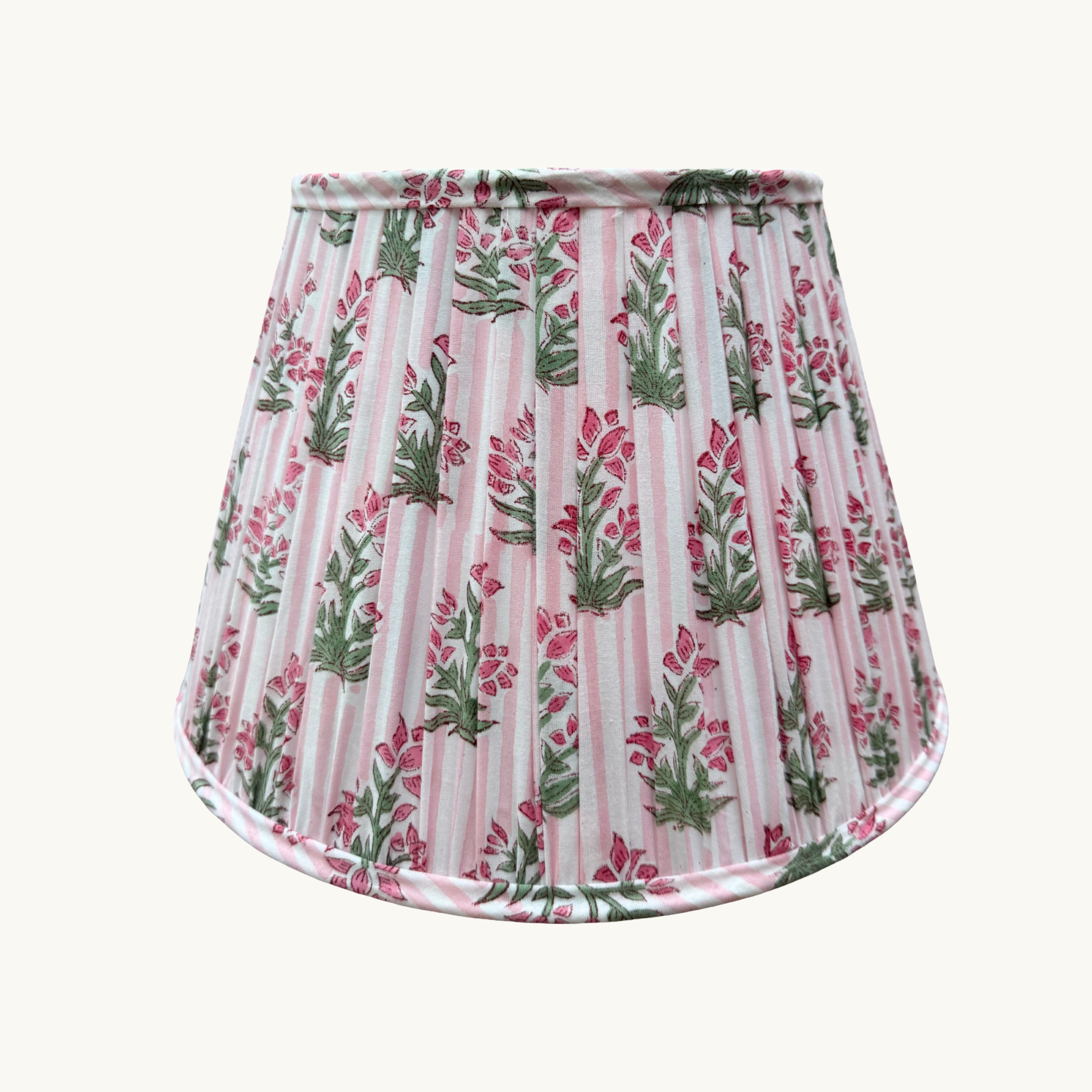 Floral patterned lampshade with pink and green design on a white background
